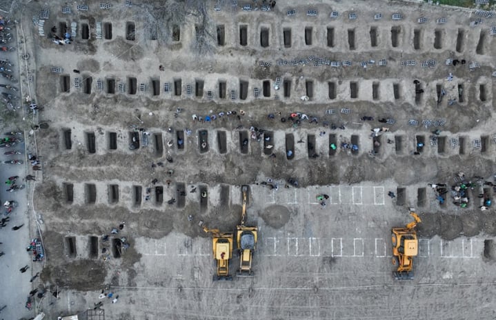 In this aerial handout picture released by the Iranian Press Center, mourners dig graves during the funeral for children killed in a reported strike on a primary school in Iran’s Hormozgan province in Minab on March 3, 2026. Iranian media have reported hundreds of Iranian casualties, including at a girl's school, although AFP reporters have not been able to verify tolls independently. The war launched by the United States and Israel against Iran spread across the Middle East, threatening to plunge the global economy into chaos, with Lebanon and Gulf energy exporters dragged into the conflict.
Iranian Press Center / AFP